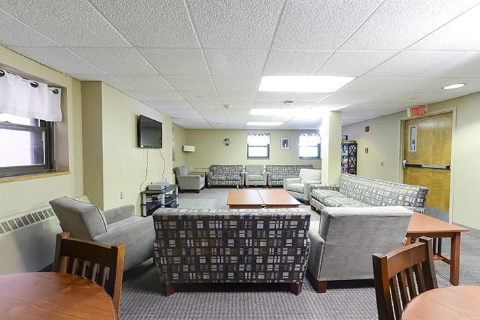 McGill House Community Space - several couches and chairs and a tv